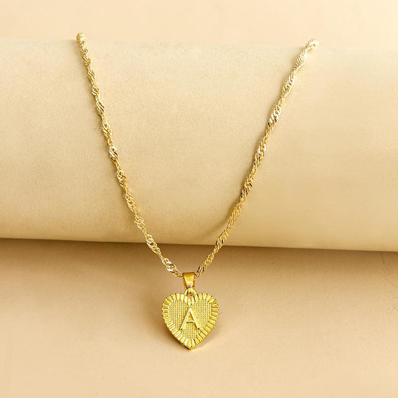 Amara - Collier cœur doré à pendentif initiale