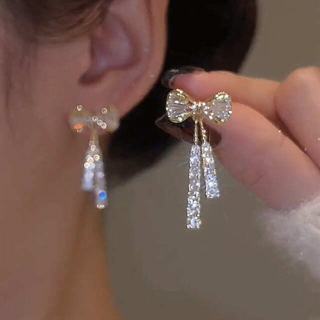 Arlette - Boucles d'oreilles nœud doré zircone chic