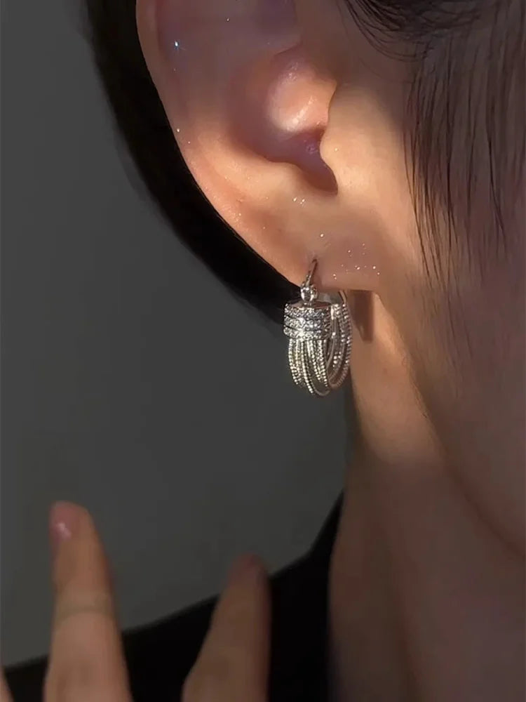 Aria - Boucles géométriques multicouches au style audacieux